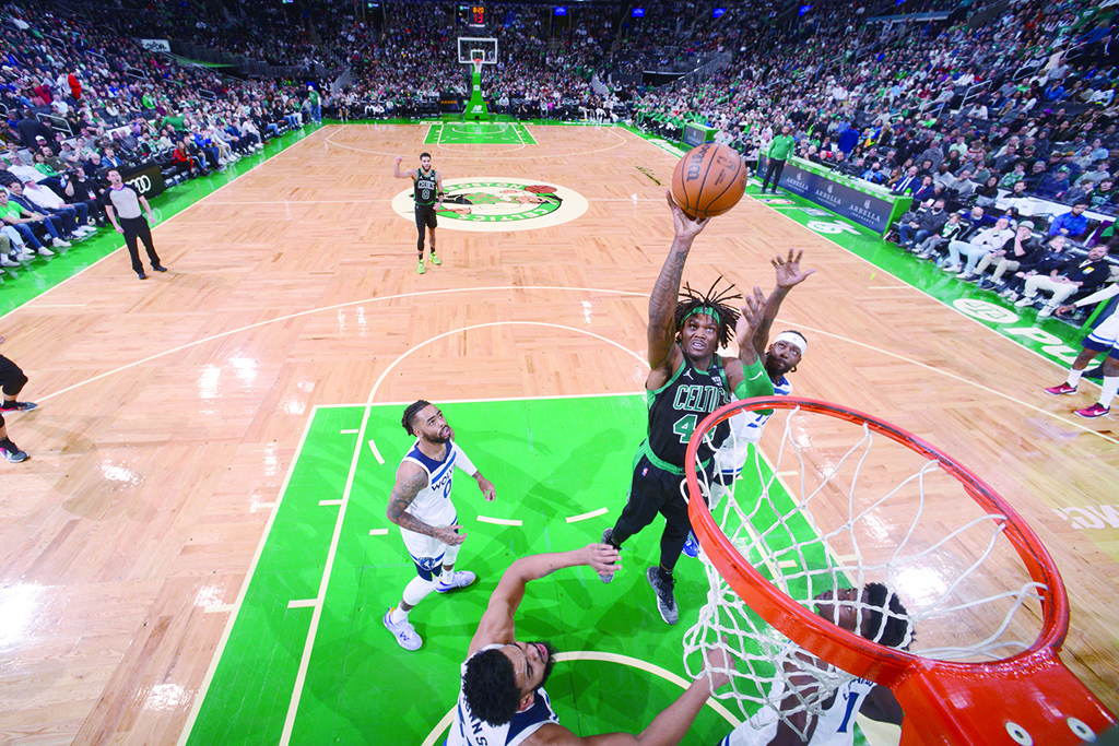 BOSTON: Robert Williams III #44 of the Boston Celtics shoots the ball during the game against the Minnesota Timberwolves on March 27, 2022.- AFP