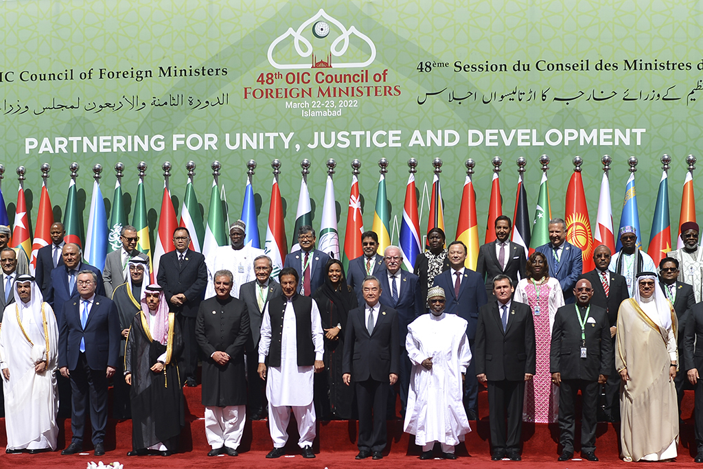 ISLAMABAD: Pakistani Prime Minister Imran Khan poses with Organization of Islamic Cooperation foreign ministers and representatives yesterday. - AFP