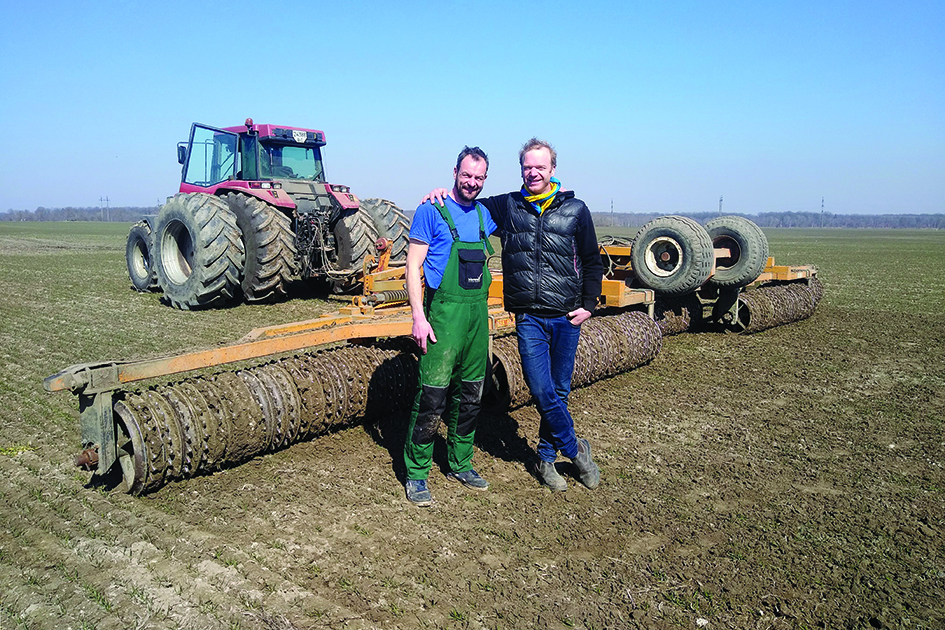 DEHRZIV, Ukraine: German farmers Tim Nandelstadt (left) and Torben Reelfs pose on the field of their farm in western Ukraine on March 23, 2022. – AFP